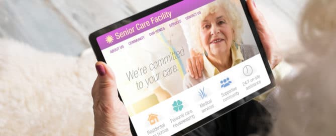 Senior woman looking at senior care facility website on tablet computer